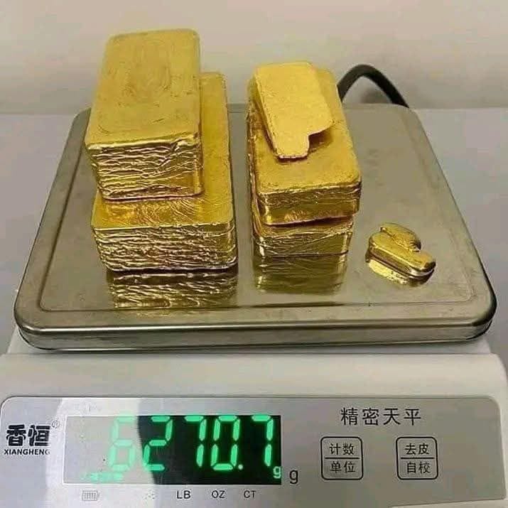 Gold bars on a weighing scale