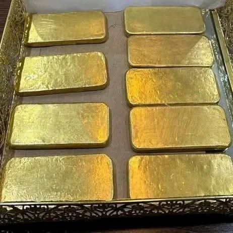 Gold bars arranged in a tray